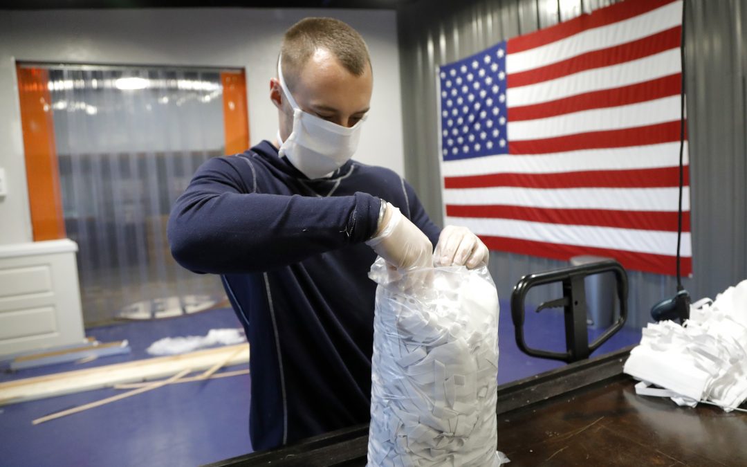 Job cuts pile up, Ford to make ventilators at parts plant