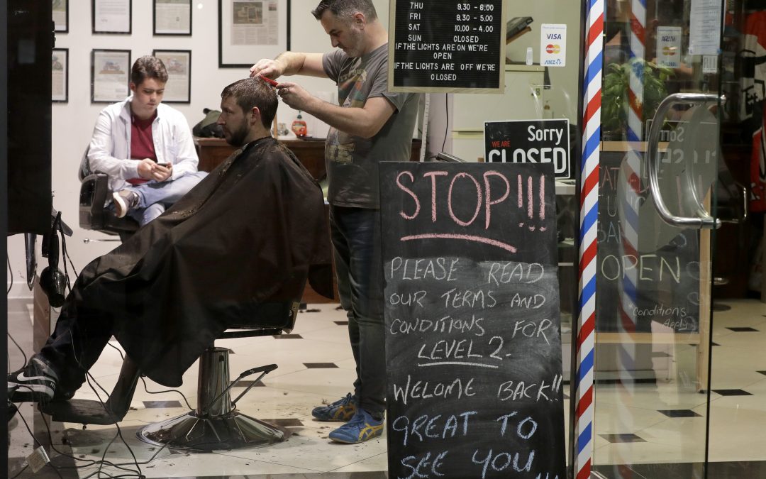 New Zealand barber snips away at midnight as nation reopens