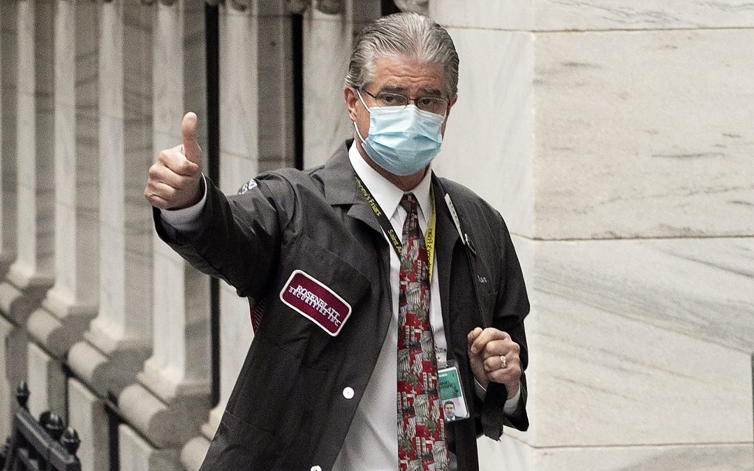 Bell rings but trading floor chaos subdued as NYSE reopens