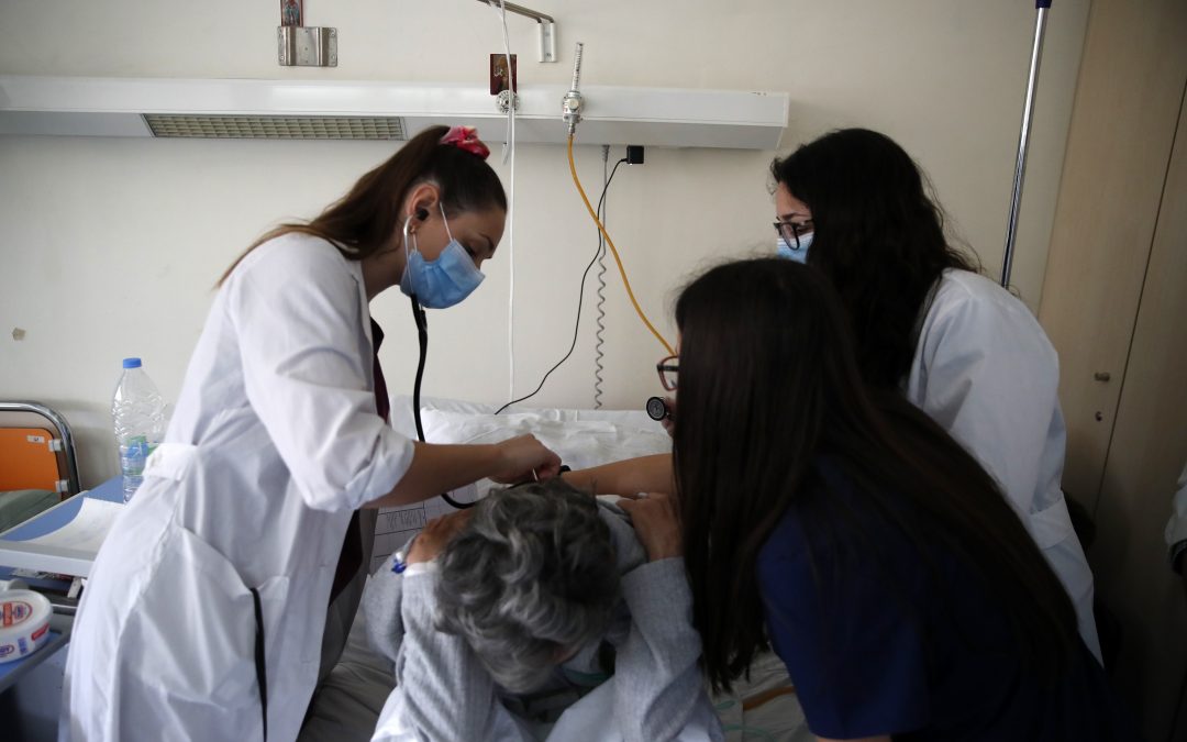 AP PHOTOS: Medical students help virus hospital in Greece