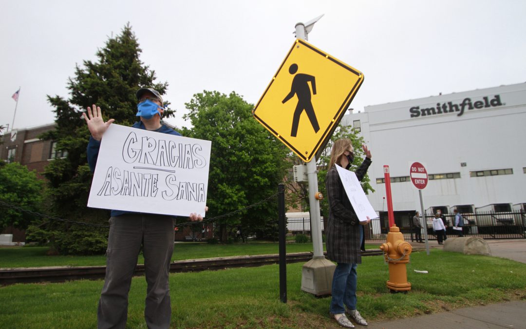 Workers cheered as they enter South Dakota pork plant