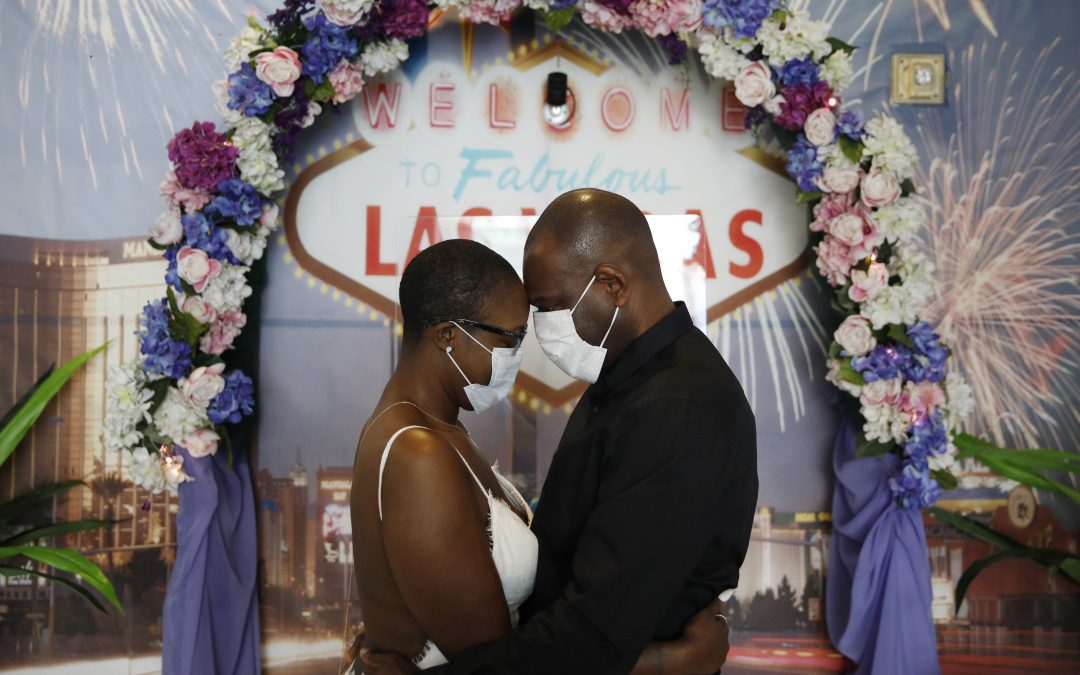 Using face masks and sanitizer, couples say ‘I do’ in Vegas