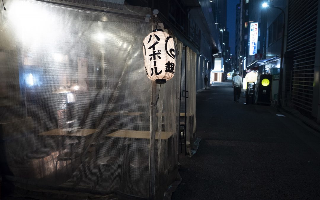 Japan says economy contracted less than earlier reported