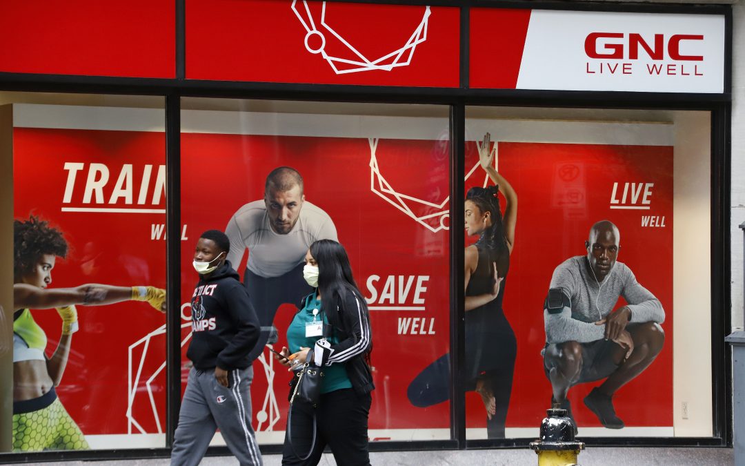 GNC files for Ch. 11 bankruptcy protection, Ugg in demand