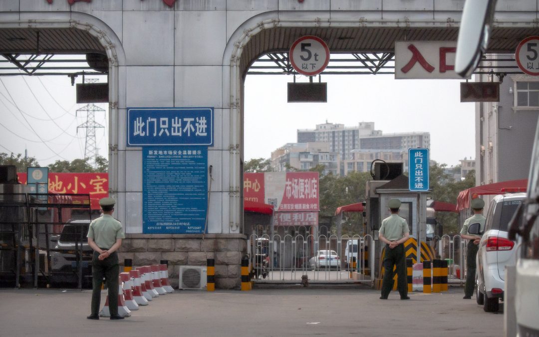 Beijing closes market, locks down area in new virus outbreak