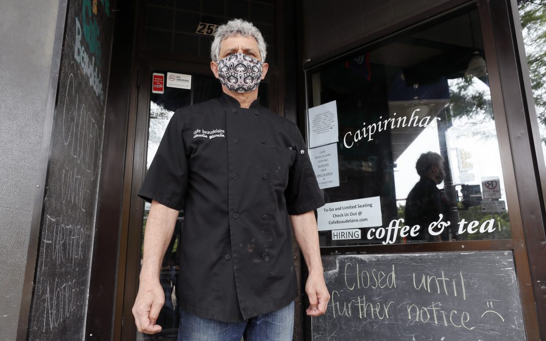 Virus cases spike among young adults in Iowa college towns